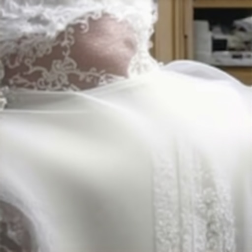 Expert restoring delicate vintage wedding gown in Tampa's climate-controlled environment